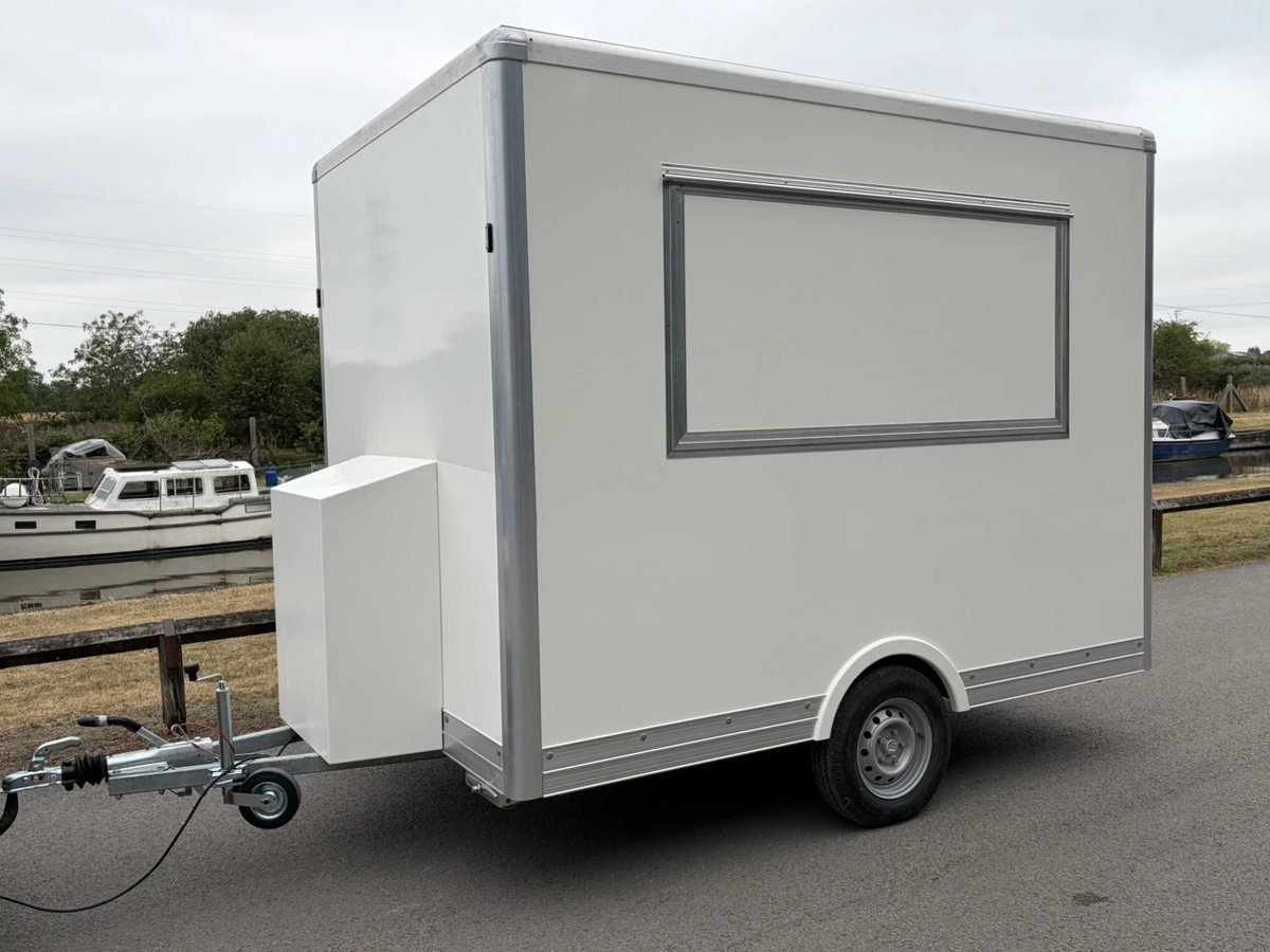 White catering trailer, serving side with the hatch closed